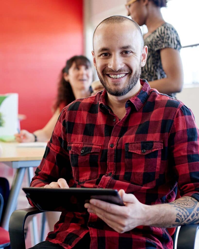 IT expert working on tablet