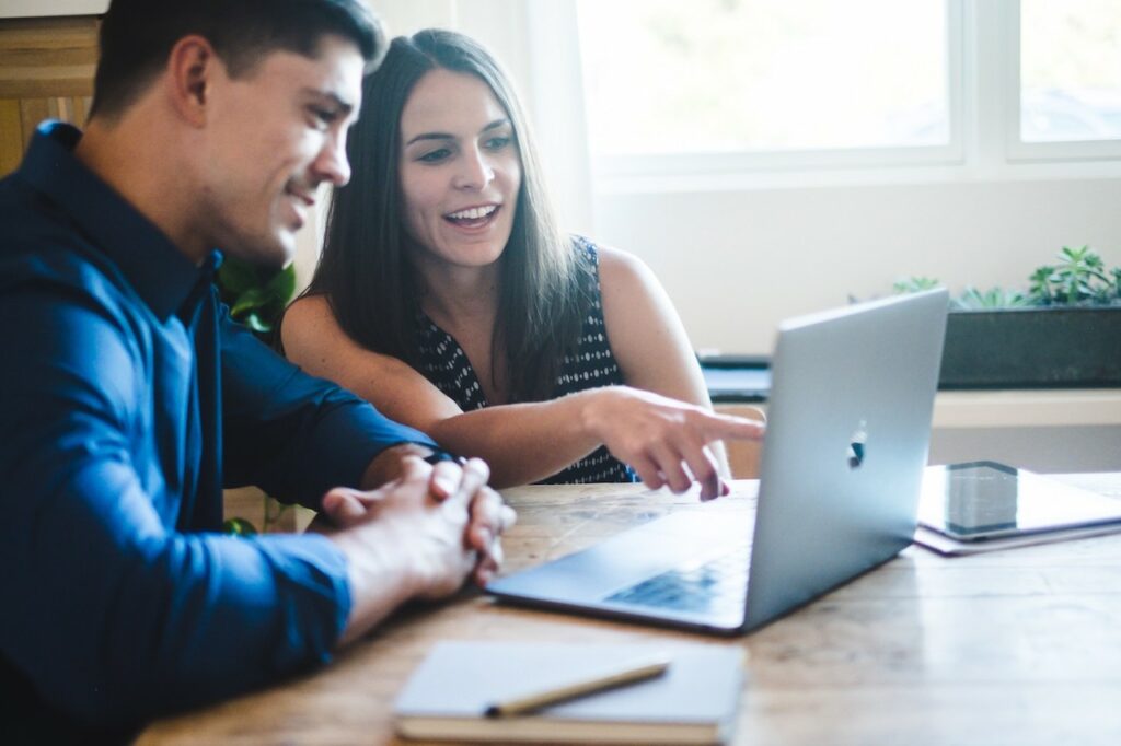 Man and woman looking at computer