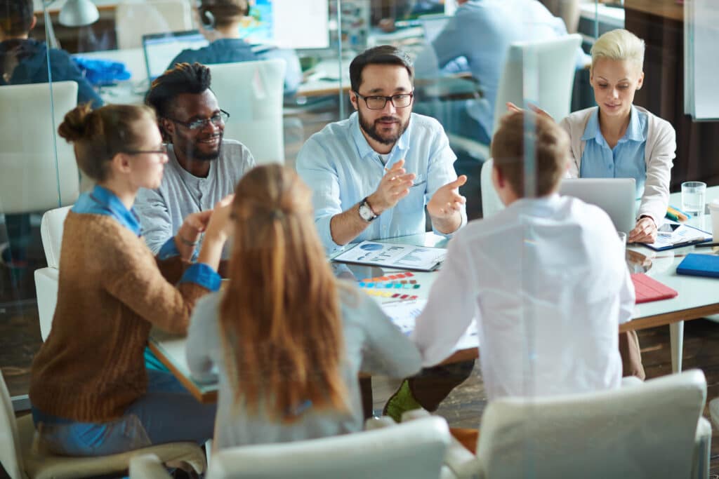 IT management speaking to a group of employees