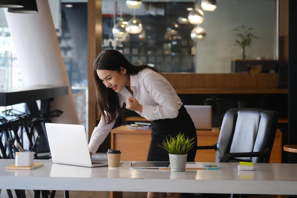 Business woman using laptop at her desk